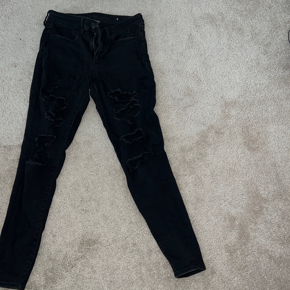 Solid Black American eagle low rise jeggings with rips